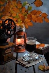 Autumn leaves, Coffee Grinder and cup of black coffee. Background for website, bloggers, social media. 