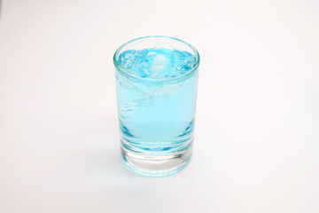 blue alcoholic drink in a decanter. Cocktail with blue gin , tonic