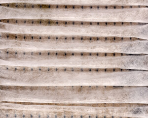 Close up pattern of a clean air furnace or air conditioning filter.