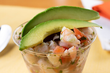 A view of a cup of shrimp ceviche.