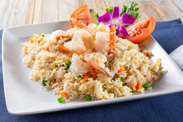 A view of a plate of shrimp fried rice.