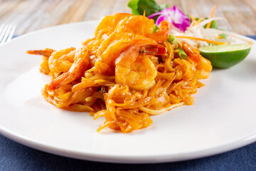 A view of a plate of shrimp pad Thai.