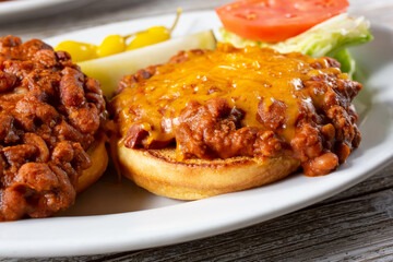 A view of a chili cheese burger.