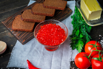 Chum salmon caviar in a glass bowl . Seafood, delicacies, healthy nutrition. 