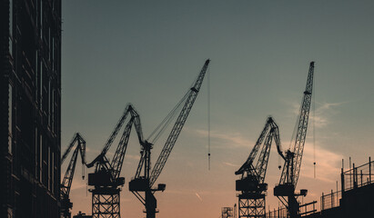Old dockyard crane silhouttes in the evenging at sunset in Helsinki Finland - 395977903