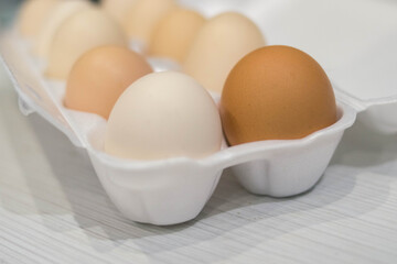 The eggs are in a row in a white tray
