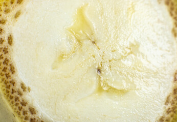 Close up photo of banana on white background. Bananas fruit cut in half, macro view.