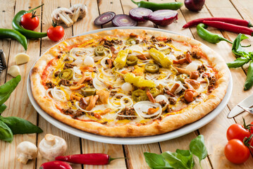 tasty pizza on the wooden background