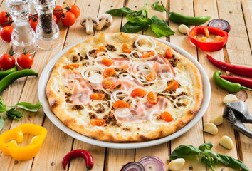 tasty pizza on the wooden background