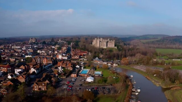 The historic town of Arundel aerial footage with the River Arun passing Arundel Cstle and the Cathedral in the background.