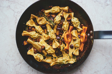 Hot homemade ravioli with ricotta cheese and spinach in a frying pan Traditional Italian food 