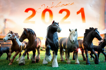 plastic figurines of group of horses celebrates the 2021 new year