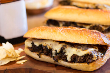 Meat snack with melted cheese. Snack of shredded meat with cheese. Meat and potato snack.