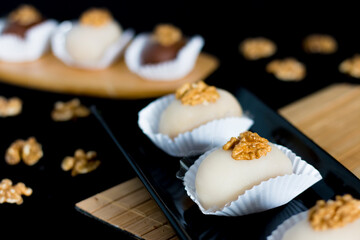 Sweet cameo on the table. Cameo dessert. Cameos with nuts on top.