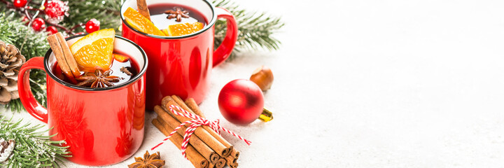 Mulled wine. Traditional christmas and winter drink with red wine, citrus and spices. Long banner...