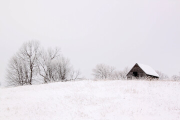 Small building on a hill on a frosty day in rural Minnesota, USA.
