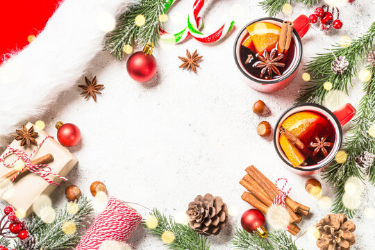 Winter holidays composition. Christmas decorations with mulled wine and spices. Top view image with copy space.