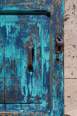 Old, blue door of abandoned building