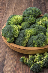 A lot of broccoli for diet and healthy eating. Fresh green broccoli on a   table.Broccoli vegetable is full of vitamin.Vegetables for diet and healthy eating.Organic food.