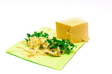 Cooking a vegetarian breakfast. pita with greens and cheese