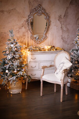 Christmas gifts are under the tree. A snow-covered tree and a chair near the fireplace. New year's interior decor.