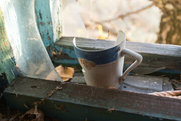 Fototapeta na wymiar Dirty tableware in abandoned village of Chernobyl zone