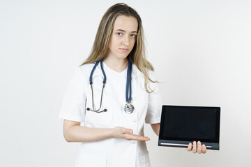 Medicine and health concept. Doctor pointing with his hand to the tablet.