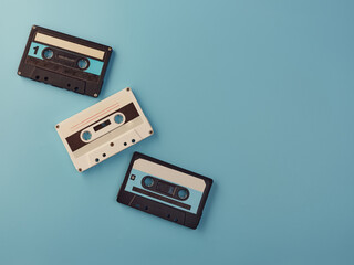 Vintage audio cassettes on blue background
