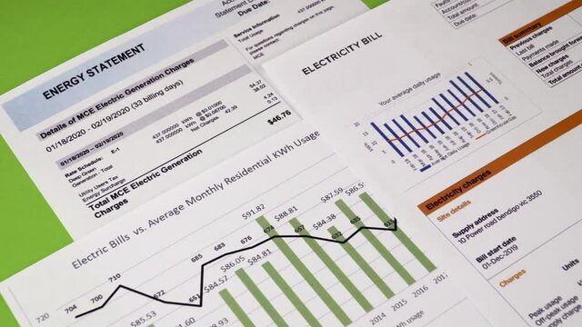 Communal payments. Energy statement, Electricity bill sheets and diagram, close-up. Horizontal camera movement