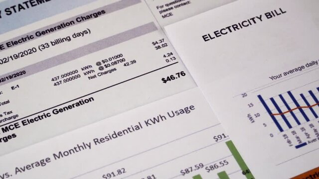 Communal payments. Energy statement, Electricity bill sheets and diagram, close-up. Zoom out video shot