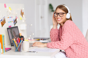 Happy young woman making video call  to grandmother on Christmas day.