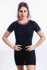 Fototapeta premium Beautiful young woman in black dress studio portrait