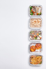 take away lunch boxes with fresh meal in foil container or healthy food delivery