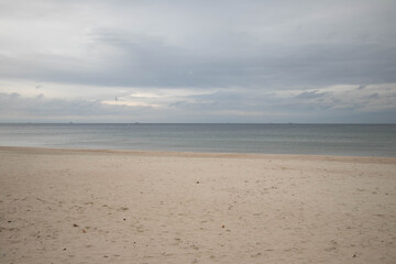 beautiful calm sea waving in the early morning on a golden sandy beach