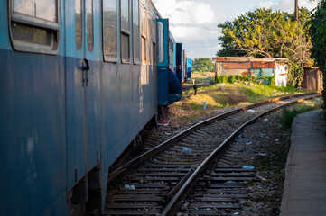 Blue wagons of an old train on the lines in a country town