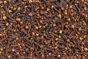 Cloves dried and ready for use, top view background or texture.