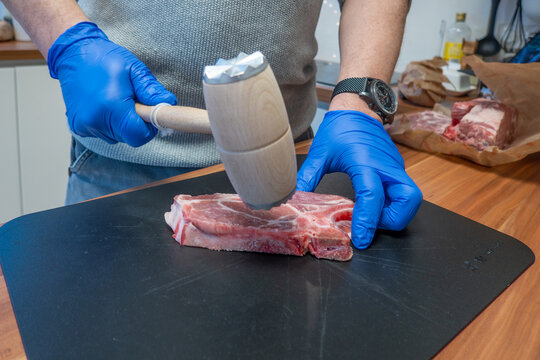  schnitzel is beaten soft with a beater