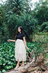 A Potraiture beautiful woman at the greening forest