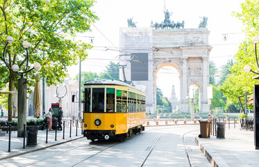 Arch of Peace view with nostalgic yellow tram in MILANO, ITALY. - obrazy, fototapety, plakaty