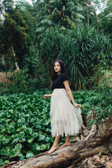 Fototapeta premium A Potraiture beautiful woman at the greening forest