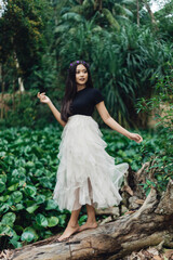 A Potraiture beautiful woman at the greening forest