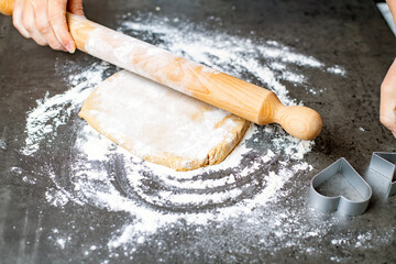 christmas and new year holidays, mom and children prepare gingerbread cookies