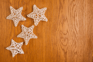 Fototapeta na wymiar traditional crochet Christmas tree decorations, wooden background, christmas, flat lay