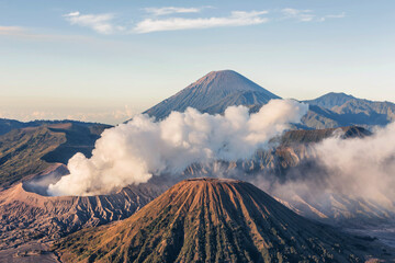 Fototapeta na wymiar Three mountain,Mount Bromo, Batuk And semeru is an active volcano and part of the Tengger massif, in East Java, Indonesia.