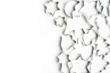 tin forms for cookies and gingerbread on a white background lie on the right side, for your text place on the left