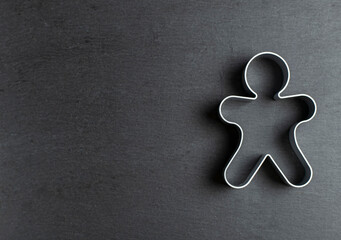 cookie mold in the form of a man on ardesia