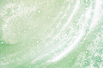 Cosmetic foam texture background. Foam with bubbles. 