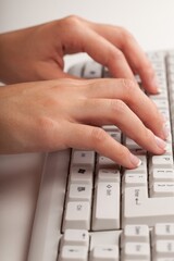 Hands Typing on a Keyboard