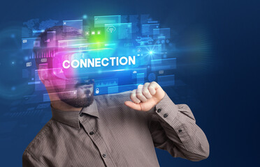Businessman looking through Virtual Reality glasses with CONNECTION inscription, innovative security concept