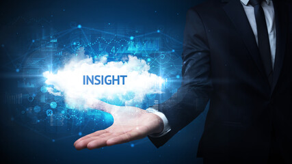 Hand of Businessman holding INSIGHT inscription, successful business concept